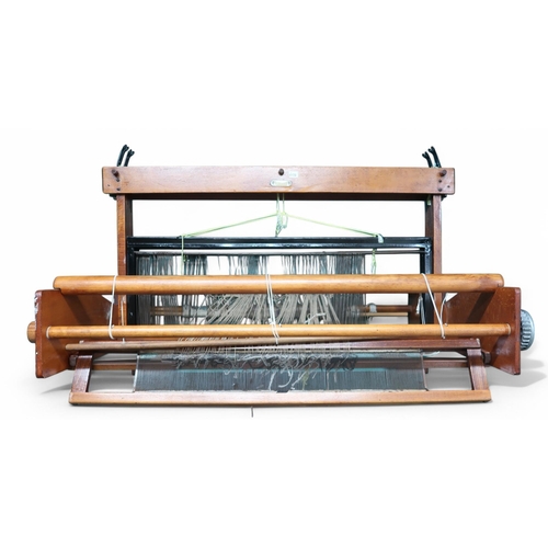 6106 - A Weavemaster table top loom and a spinning wheel