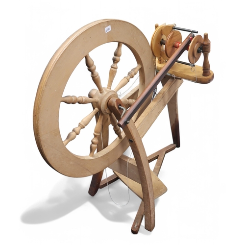 6106 - A Weavemaster table top loom and a spinning wheel