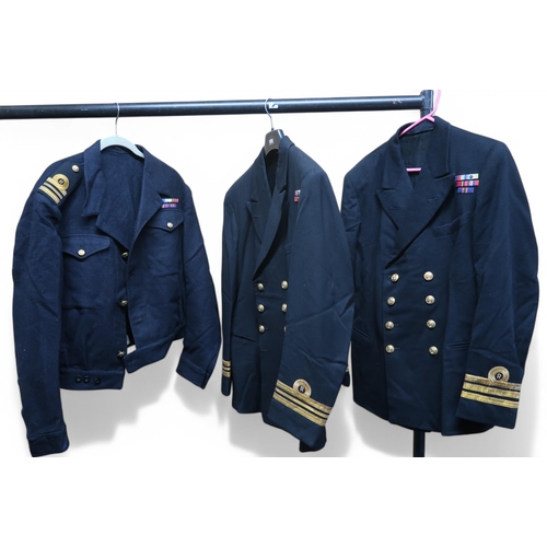 6113 - A Royal Navy Commanders dress jacket, a Royal Navy Officers dress jacket and dinner jacket, an Offic... 