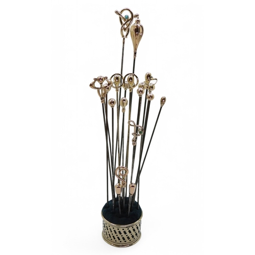 700 - A collection of 9ct gold Art Nouveau hatpins, to include;- a matching pair of Charles Horner, with C... 