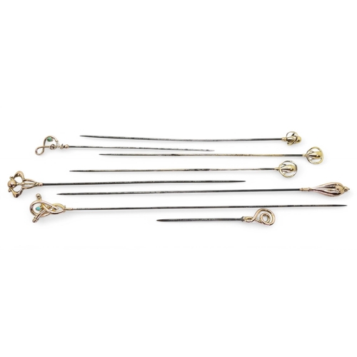 700 - A collection of 9ct gold Art Nouveau hatpins, to include;- a matching pair of Charles Horner, with C... 