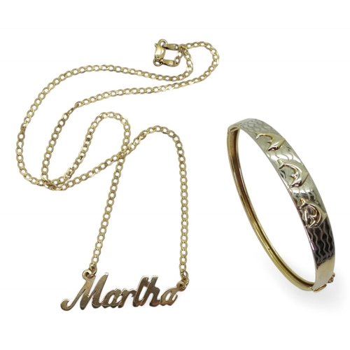 705 - A 9ct yellow and white gold dolphin bangle, together with a 9ct gold Martha pendant necklace, weight... 