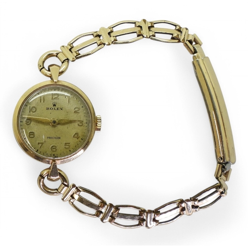 713 - A ladies 9ct gold Rolex watch with a gold plated strap, hallmarked London 1957, weight with out mech... 