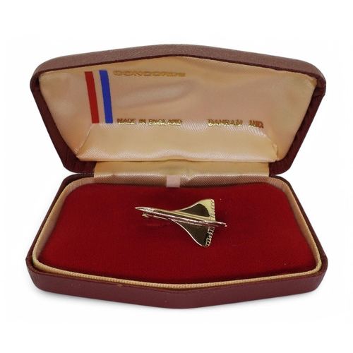 714 - A 9ct gold Concorde brooch with Birmingham hallmarks for 1976, length 3cm, weight 3gms, in original ... 