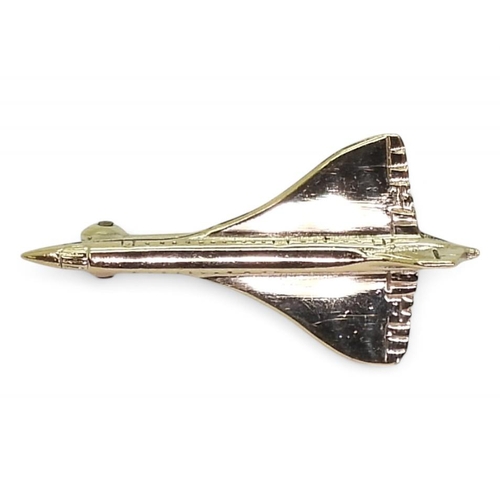 714 - A 9ct gold Concorde brooch with Birmingham hallmarks for 1976, length 3cm, weight 3gms, in original ... 