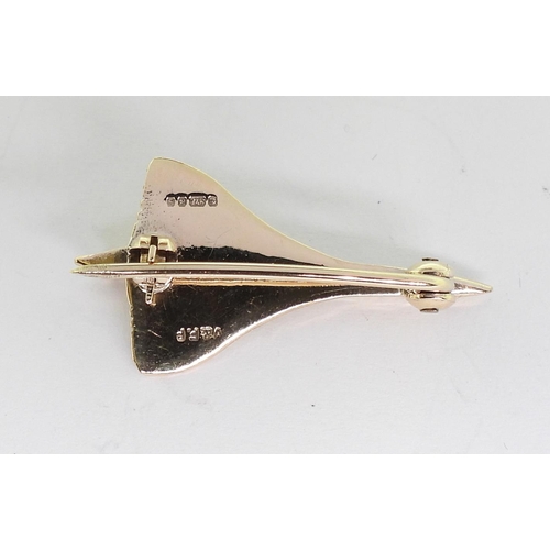 714 - A 9ct gold Concorde brooch with Birmingham hallmarks for 1976, length 3cm, weight 3gms, in original ... 