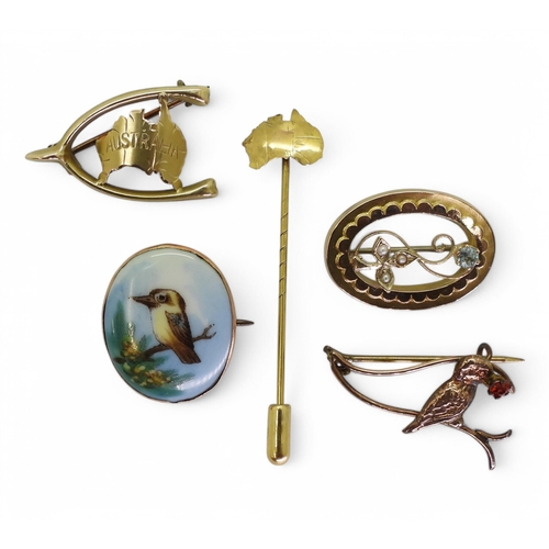 718 - A collection of Australian 9ct gold jewellery to include;- two Kookaburra brooches, one with a porce... 