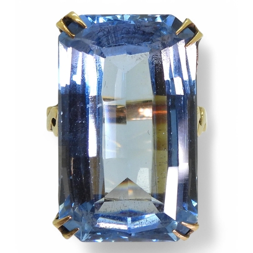 728 - A 9ct gold large fancy cut blue glass gem ring, size K1/2, weight 11.6gms