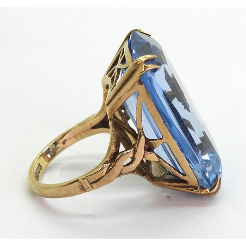 728 - A 9ct gold large fancy cut blue glass gem ring, size K1/2, weight 11.6gms