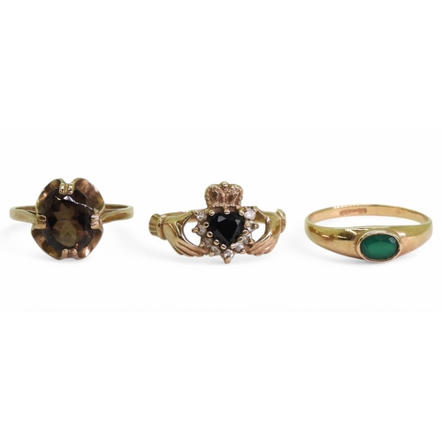 730 - Three 9ct gold rings, a smoky quartz size N1/2, Claddagh set with a sapphire, size O1/2, and a green... 