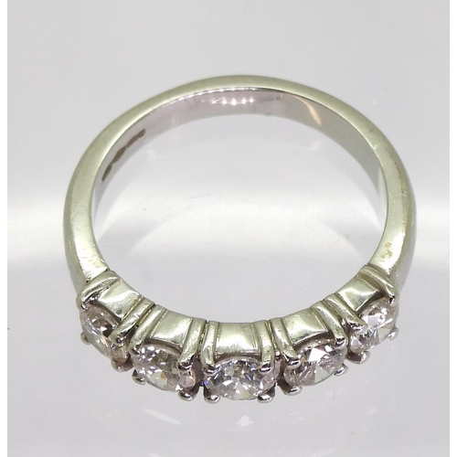 741 - A platinum five stone diamond ring, set with estimated approx 1ct of brilliant cut diamonds, size M1... 