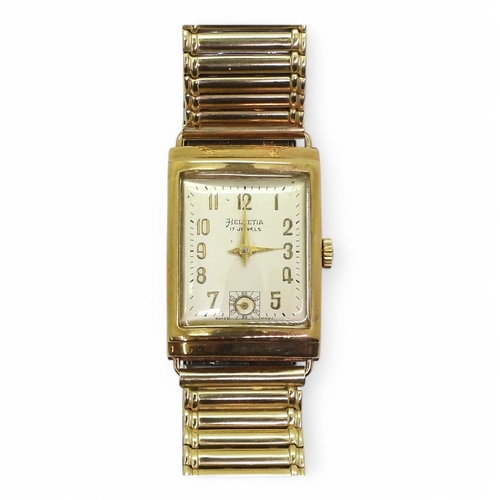 757 - A 9ct gold gents Helvetia watch hallmarked 1959, with a gold plated strap, weight with movement and ... 