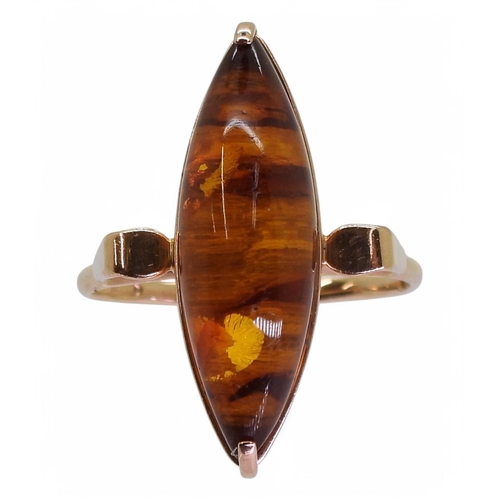 761 - A Russian amber dress ring, stamped with Hammer & sickle marks and stamped with the metal purity... 