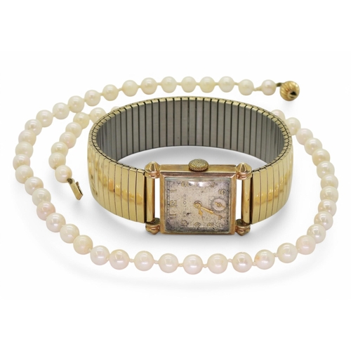 769 - A ladies '10k rolled gold plate' Bulova watch together with a string of cultured pearls with a 9ct g... 