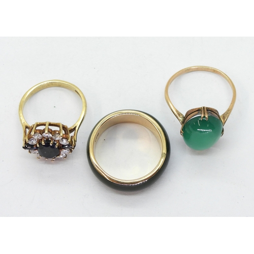 773 - A 9ct gold mounted green hardstone ring, size R1/2, a yellow metal mounted green agate ring size R, ... 