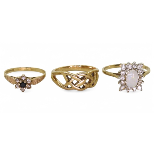 777 - Three 9ct gold rings, a retro sapphire and cz flower cluster, size F1/2, Celtic knotwork H1/2, opal ... 