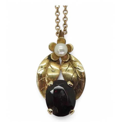 781 - A 9ct gold garnet and pearl pendant on a 44cm trace chain, weight 4gms