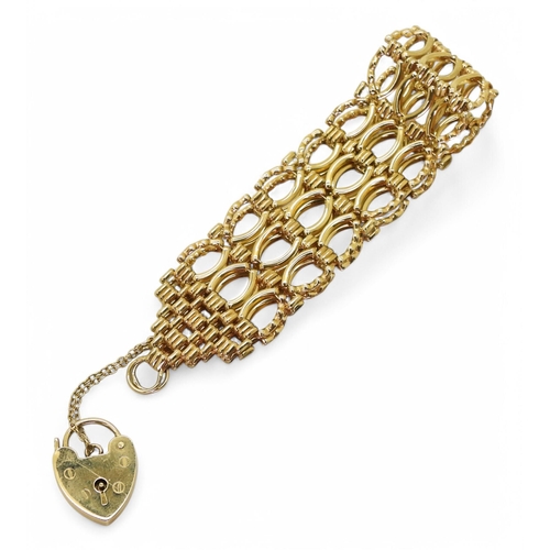 796 - A 9ct gold fancy link gate bracelet, with heart shaped clasp, length 18cm, width 2.2cm,  weight... 