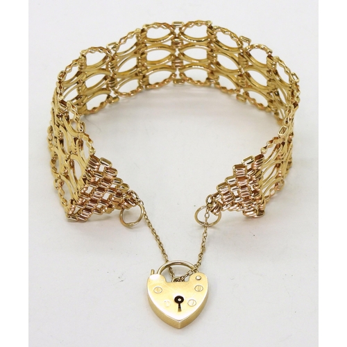 796 - A 9ct gold fancy link gate bracelet, with heart shaped clasp, length 18cm, width 2.2cm,  weight... 