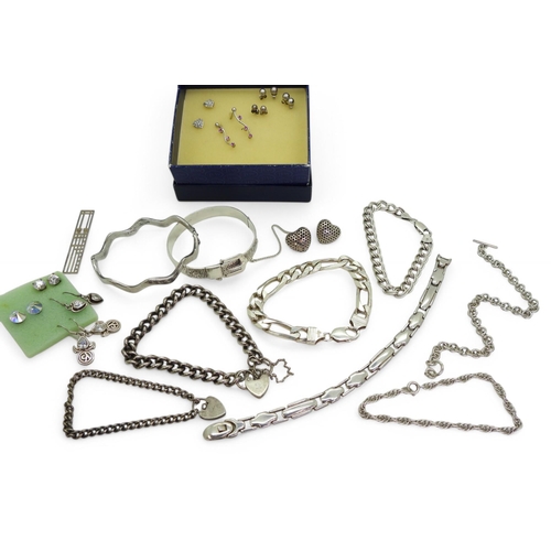 857 - A collection of silver and white metal jewellery to include a silver buckle shaped bangle with Sheff... 