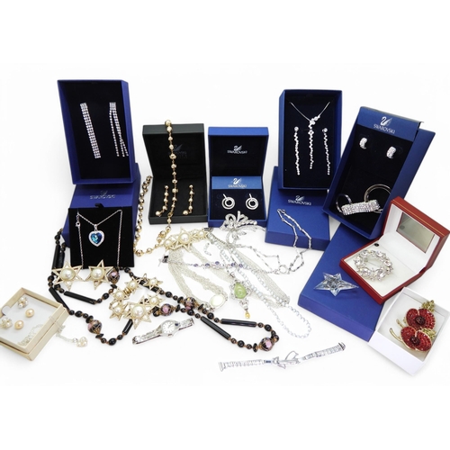 865 - A collection of costume jewellery to include items by Swarovski in original boxes, Butler & Wils... 