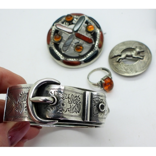 871 - A silver bangle in the shape of a buckle with Birmingham hallmarks for 1888, a Scottish brooch inlai... 