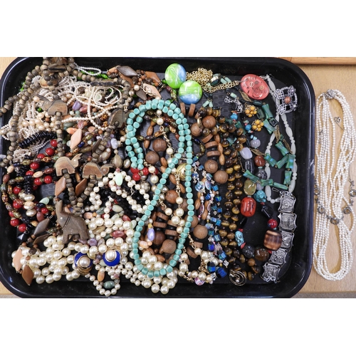 874 - A large collection of vintage costume jewellery to include;- a string of tiger's eye beads, a string... 