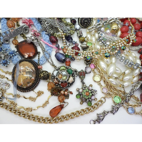 882 - A large collection of vintage costume jewellery to include beads, diamante necklaces, a metal studde... 