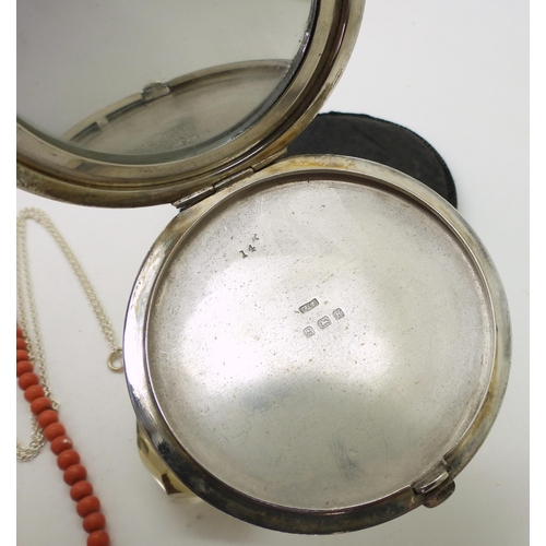 887 - A silver compact with Birmingham hallmarks for 1941, a string of coral beads with a 9ct gold clasp, ... 