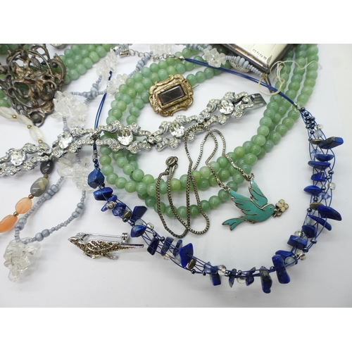 891 - A triple string of Chinese green hardstone beads, a white metal Austro Hungarian George & The Dr... 