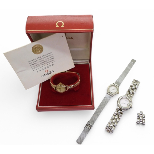 892 - A 9ct gold cased ladies Omega watch hallmarked Birmingham 1964 with a gold-plated strap, with a box ... 