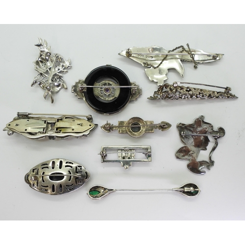 896 - Collection of marcasite brooches, set in silver and white metal, including an eagle brooch marked F.... 