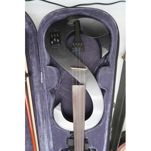 385 - A modern 'S' shaped electric violin, with a bow, a fitted case, leads, headphones and spare strings.... 