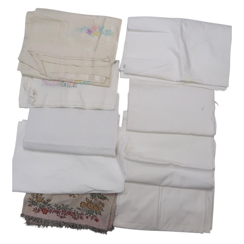 6096 - A large quantity of embroidered table linen, damask table cloths etc