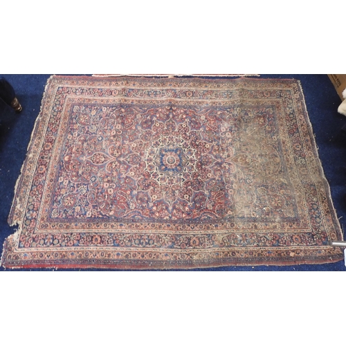 105 - A lot comprising a multicoloured ground Tabriz rug with sun burst central medallion and dark blue sp... 