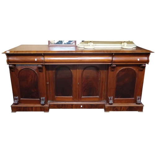 110 - A Victorian mahogany sideboard with three frieze drawers over pair of central cabinet doors flanked ... 