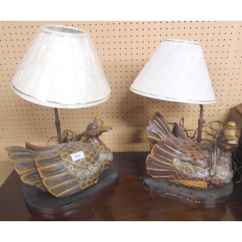 111 - A pair of 20th century table lamps with carved bases in the form of seated ducks (2)