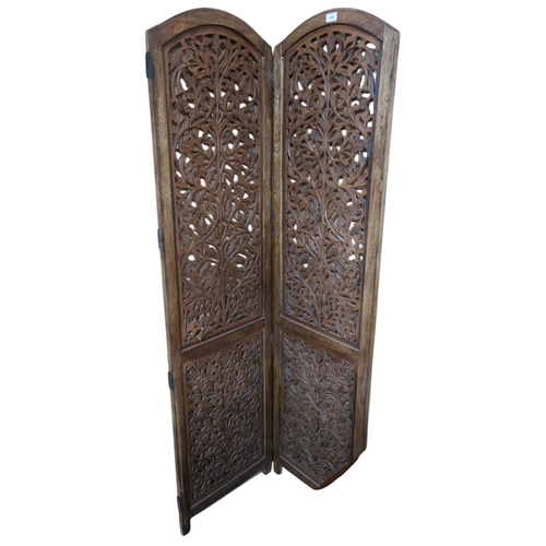 114 - An early 20th century two panel room divider with extensively pierced panels, 174cm high x 46cm wide... 