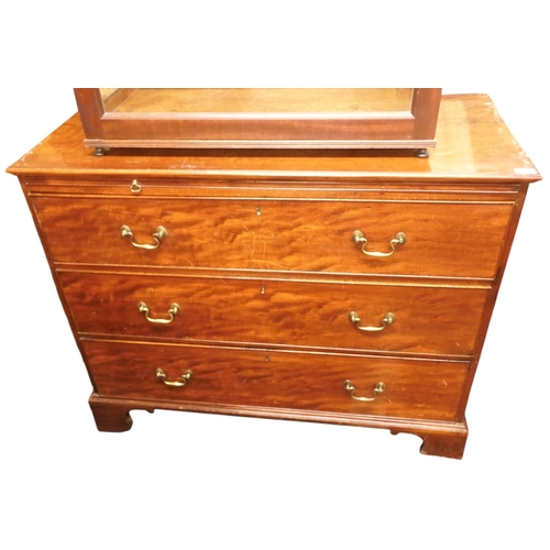 26 - A 19th century mahogany chest of drawers with pull out slide over three long graduating drawers on b... 