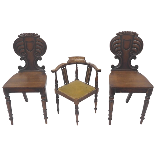 33 - A lot comprising a pair of 19th century mahogany hall chairs with carved back splats on turned suppo... 