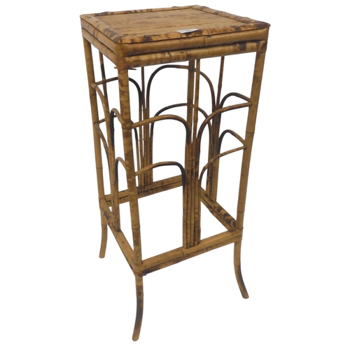 37 - A Victorian chinoiserie bamboo plant stand with square rattan top on bamboo supports joined by bent ... 