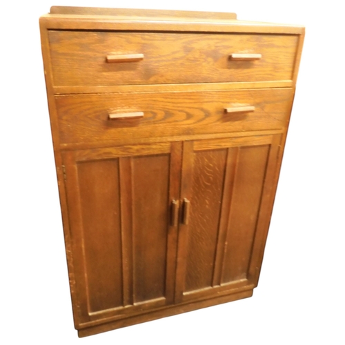 41 - An early 20th century oak tall boy bedroom chest with two long drawers over pair of panel doors on p... 