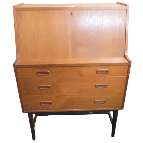 42 - A mid 20th century teak after Gunnar Nielsen writing bureau with fall front writing compartment over... 