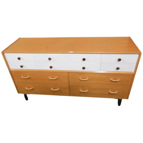 45 - A mid to late 20th century bank of drawers with six white painted drawers over two pairs over long d... 