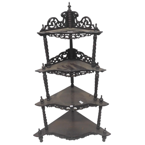 5 - A late Victorian mahogany four tier corner what-not with pierced gallery backs and turned uprights, ... 