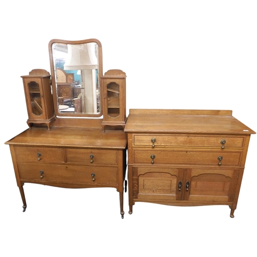 56 - An early 20th century oak two piece bedroom suite consisting mirror back dressing table with bevelle... 