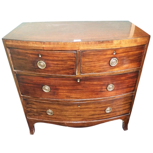 9 - A 19th century mahogany bow fronted two over two chest of drawers with brass drawer pulls on shaped ... 