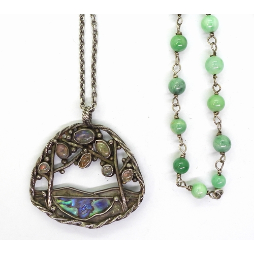 2724 - AN ARTS & CRAFTS STYLE COLLECTIONa white metal paua shell pendant set with jelly opals, length 4... 