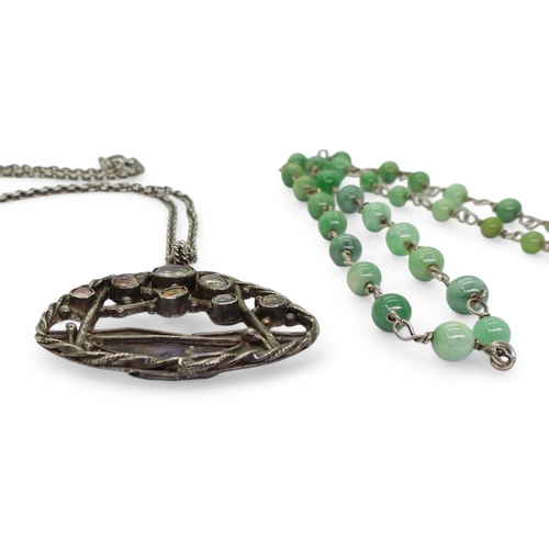 2724 - AN ARTS & CRAFTS STYLE COLLECTIONa white metal paua shell pendant set with jelly opals, length 4... 