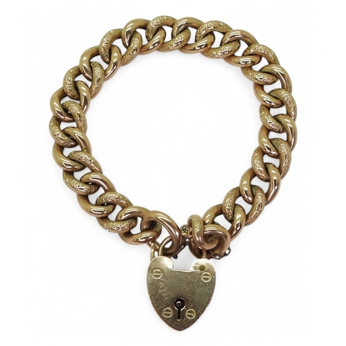 2725 - A 9CT GOLD CURB CHAIN BRACELETwith heart shaped clasp and alternate patterned links. Hallmarked Birm... 